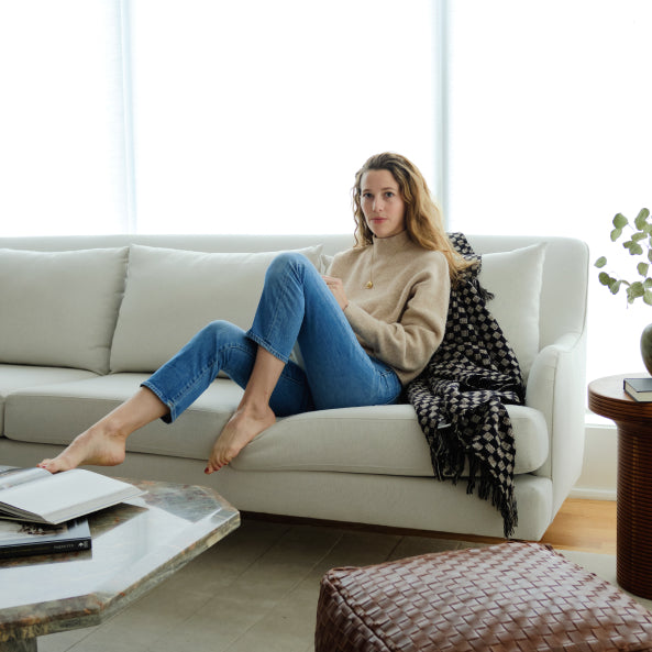 woman sitting on kaydan sofa