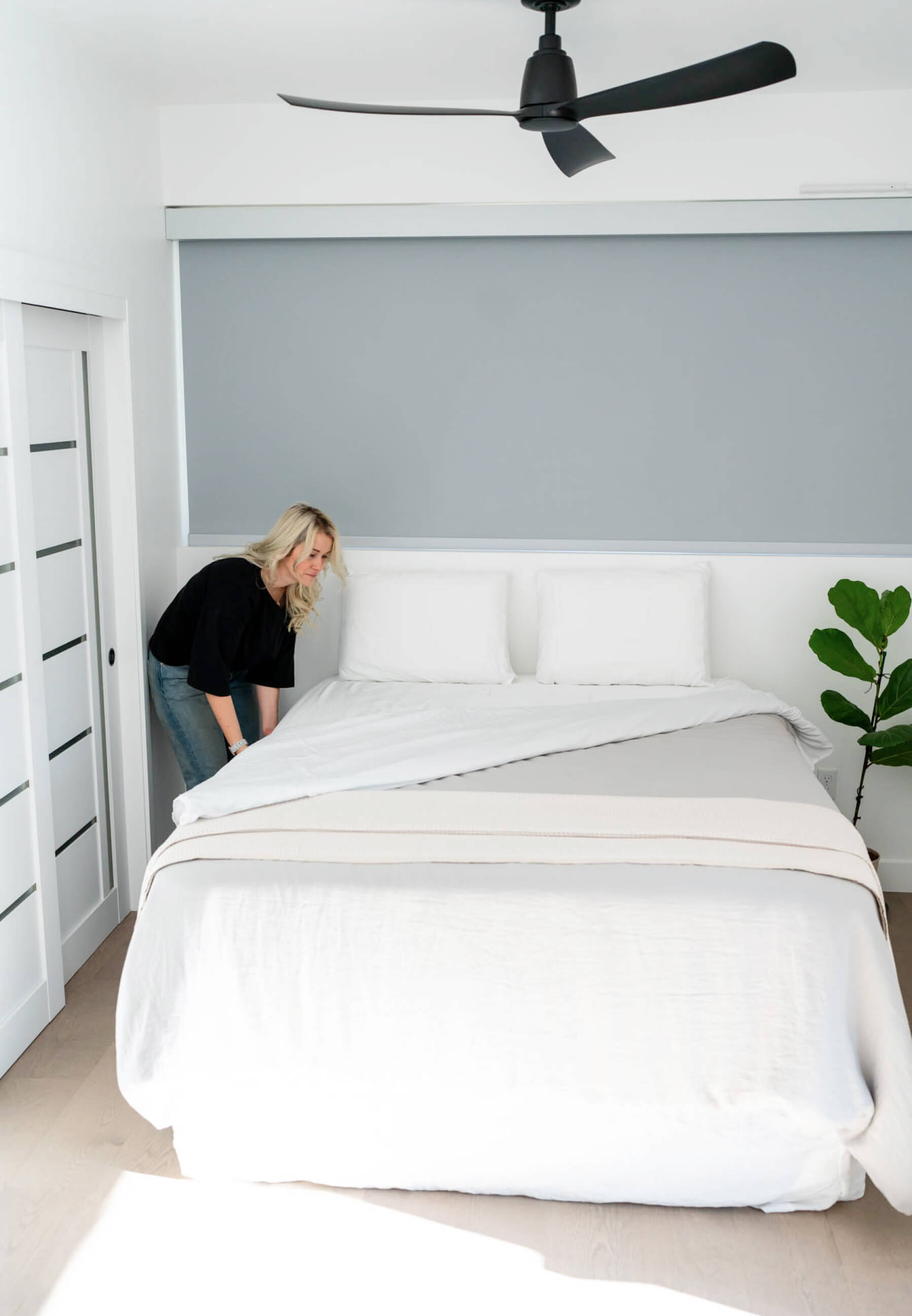 Woman making up bedding on Medley Organic Natural Latex Mattress