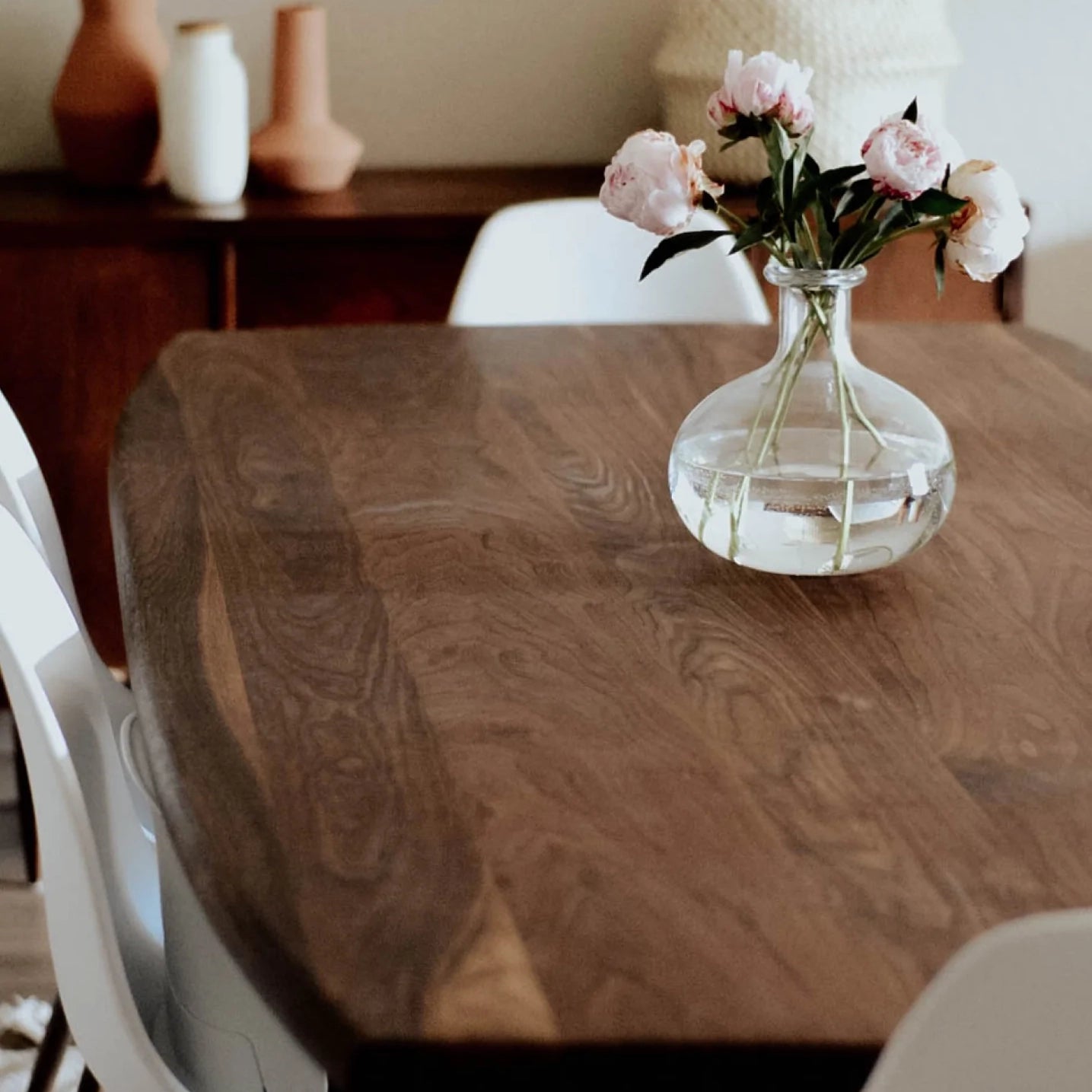 Solid walnut Medley Danu Dining Table with flower setting