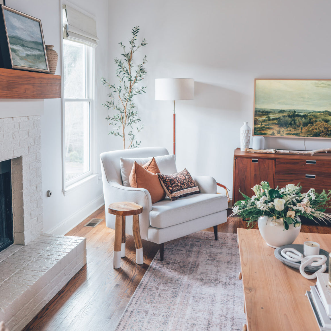 white kaydan chair in sunny living room