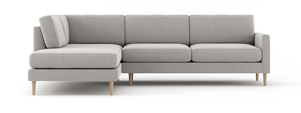 G: Lala Bumper Sectional shown in linara porridge fabric and Thom Maple legs