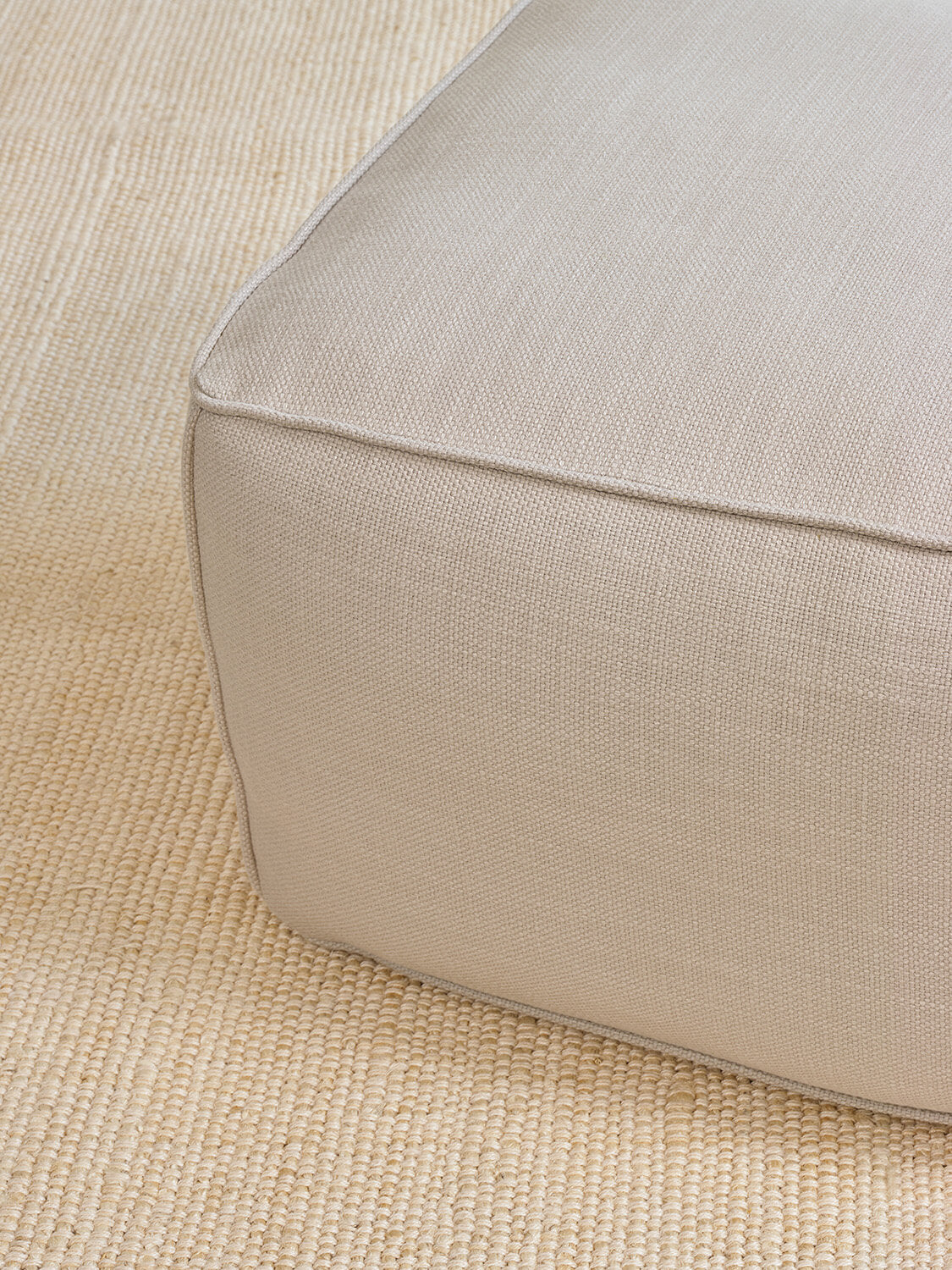 IRL: Mayer Pouf in Stonecrop Linen Natural fabric.