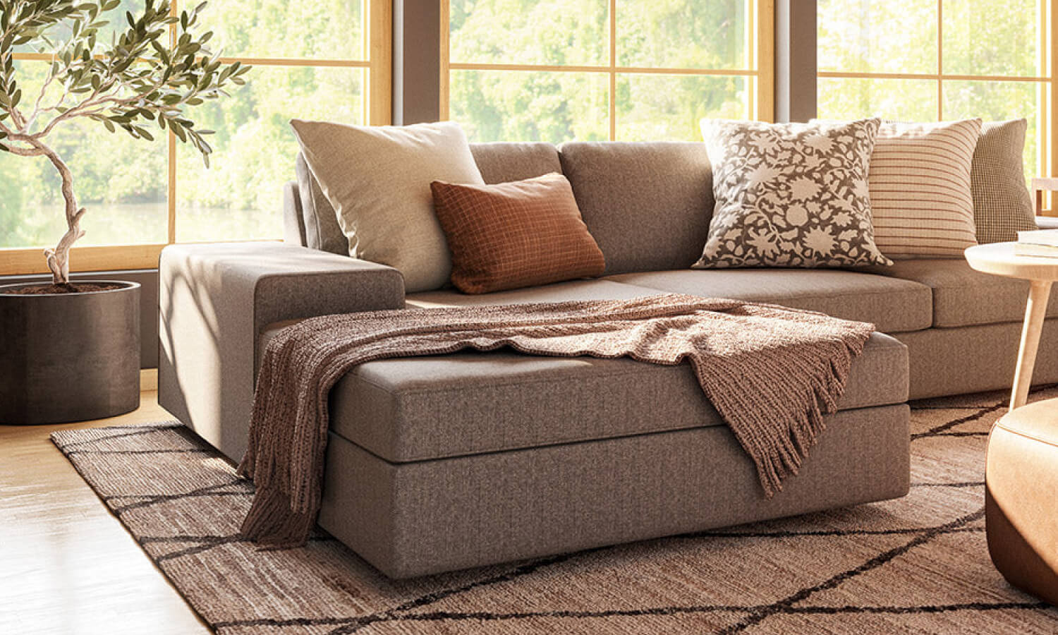 IRL: Shown in C.O.M. fabric, Voya Coffee and Side Tables, Mayer Poufs in Milo Taupe leather, and Lulu & Judge Throw Pillows