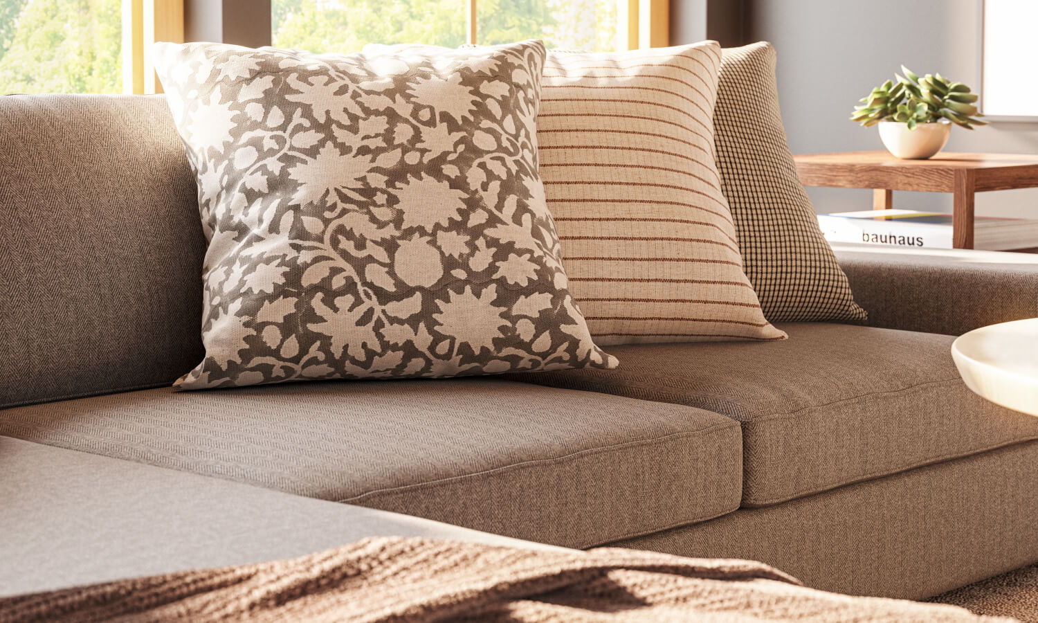 IRL: Shown in C.O.M. fabric, Voya Coffee and Side Tables, Mayer Poufs in Milo Taupe leather, and Lulu & Judge Throw Pillows