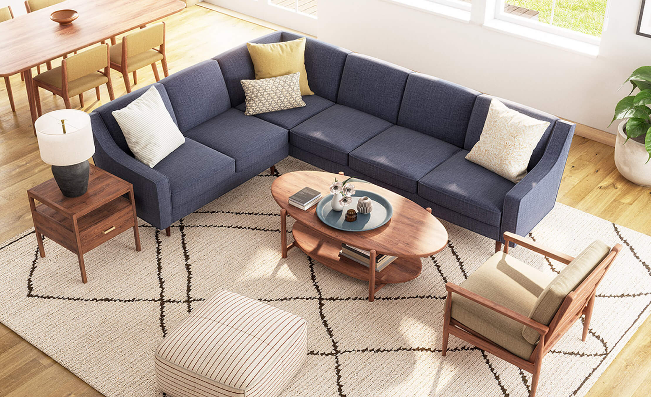 IRL: Iris Coffee Table shown in Walnut wood with Mosh Ottoman, Palder Side Table, and EIM Chair
