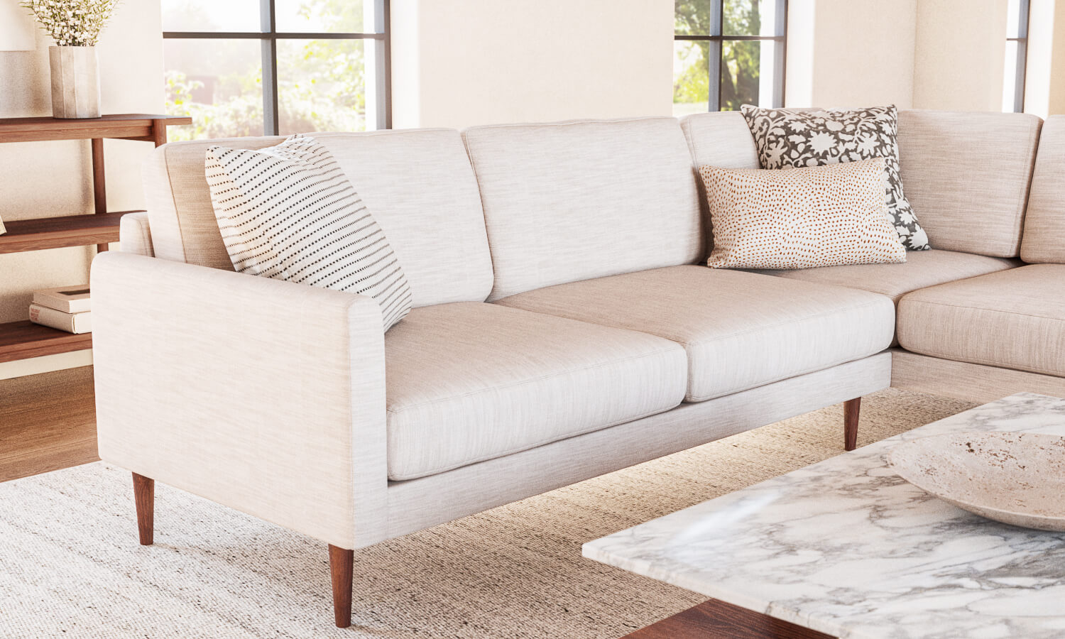 IRL: Lala Bumper Sectional in Larkspur Pearl fabric and Thom Cafe Leg, shown with Sino Coffee Table.