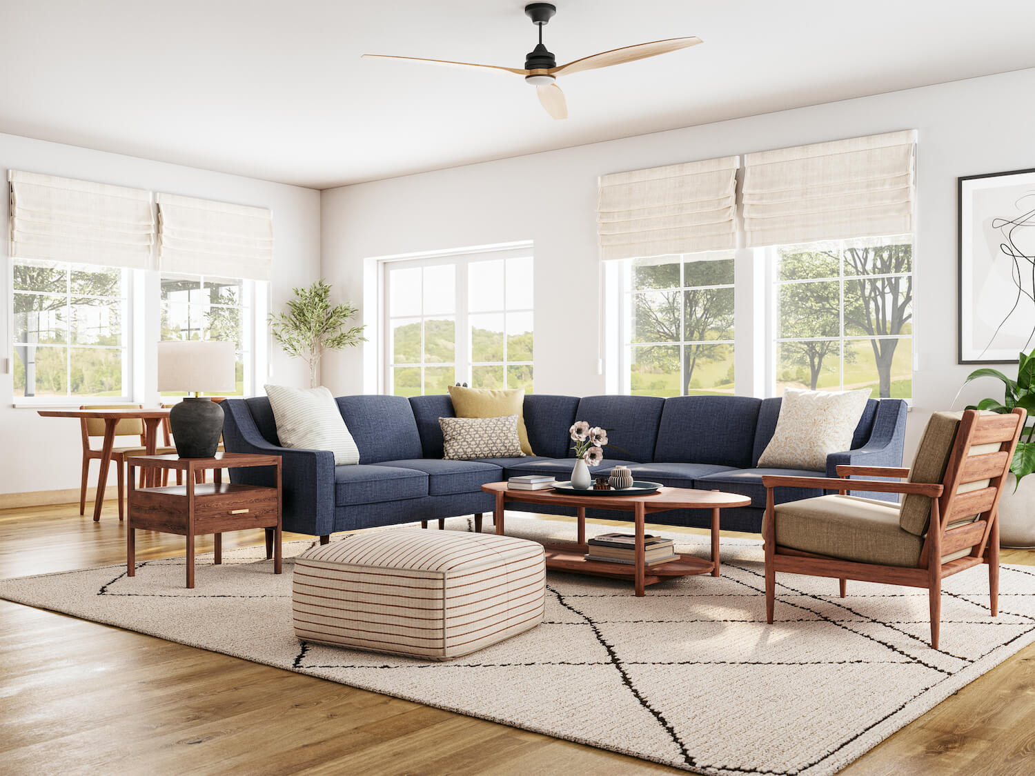 Shown in walnut wood with a brass pull next to the Zavis Sectional in Smart Navy fabric