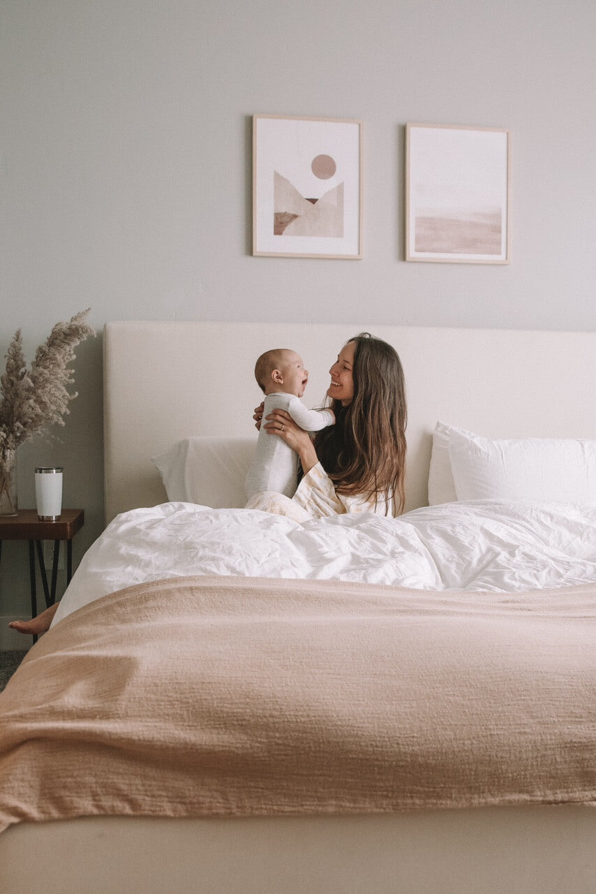 IRL: Woman and baby on Bramo Bed in cream fabric