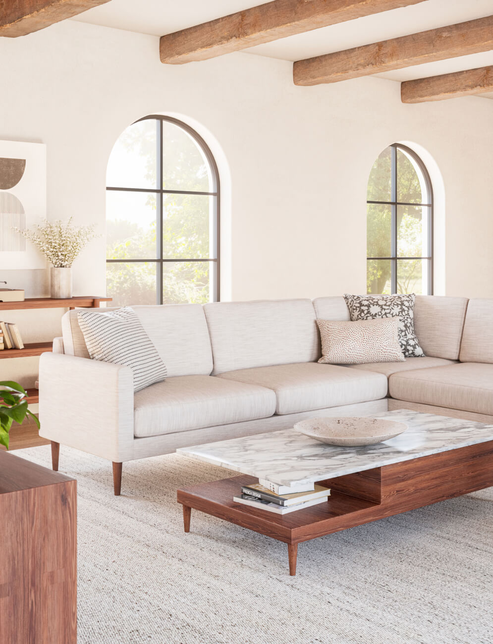 Beige Lala Bumper Sectional in white room with walnut coffee table