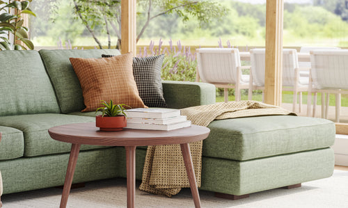 IRL: Shown in Juneberry Tarragon fabric with the Voya Coffee Table in walnut wood 