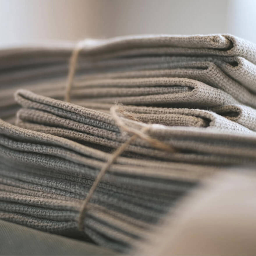 Stack of folded linen grey fabric