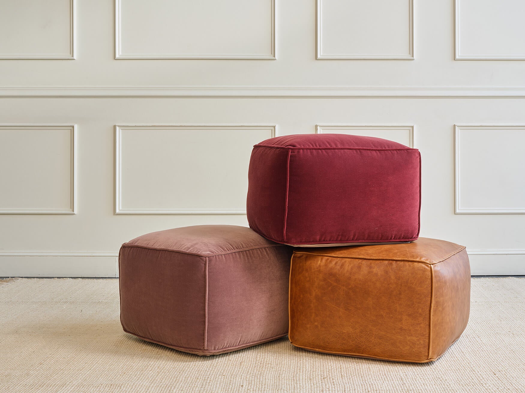 IRL: Mayer Pouf shown in Aster Velvet Raisin, Aster Velvet Rosewood, and Bodie Chestnut Leather.