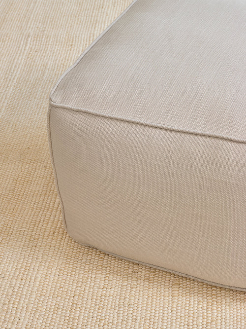 IRL: Mayer Pouf in Stonecrop Linen Natural fabric.