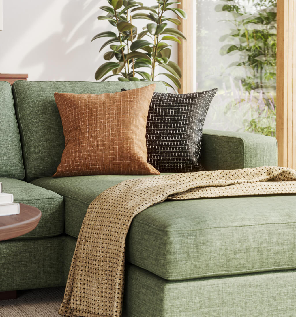 throw pillows on green sectional