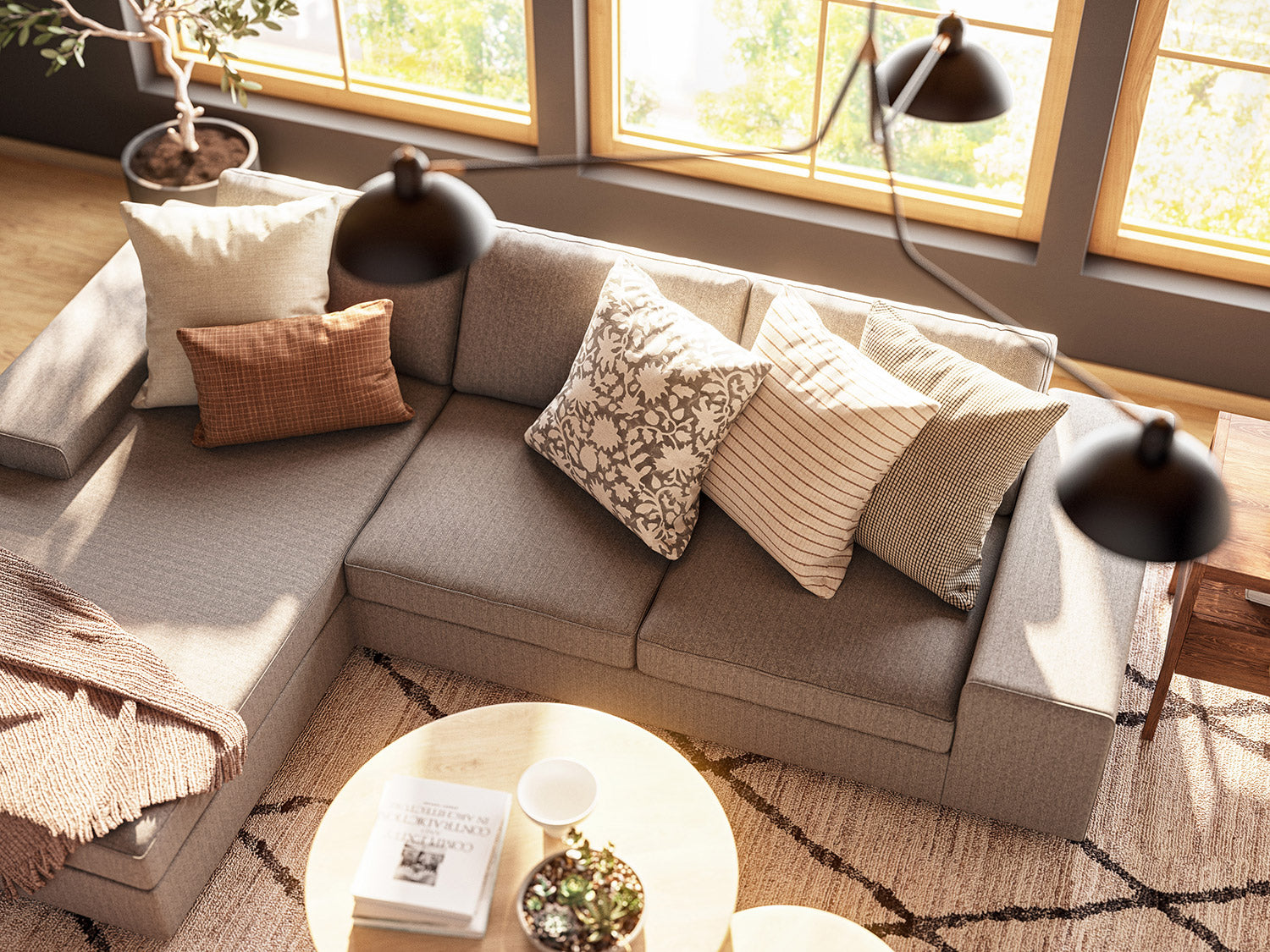 IRL: Blumen Chaise Left Sectional in Mahonia Pewter fabric, Voya Coffee and Side Tables, Mayer Poufs in Sundance leather, and Lulu & Judge Throw Pillows