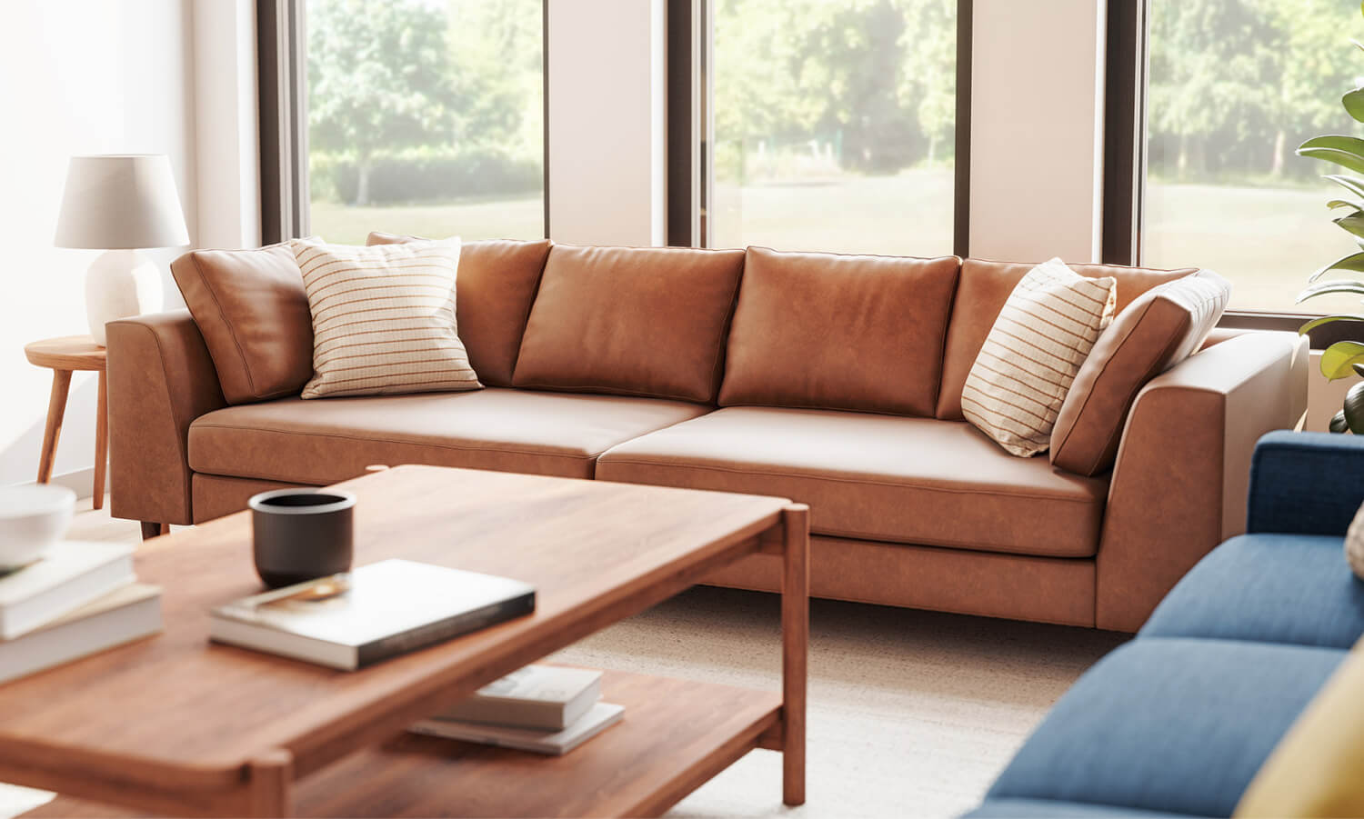 IRL: Shown in Milo Taupe Leather with Iris Rectangular Coffee Table in Walnut