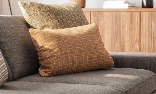 IRL: Shown in Mahonia Pewter fabric, Voya Side Table, Sino Coffee Table, Emilia 4-Door Credenza, Lulu & Judge Throw Pillows