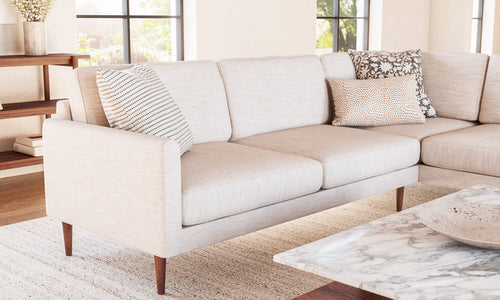 IRL: Lala Bumper Sectional in Larkspur Pearl fabric and Thom Cafe Leg, shown with Sino Coffee Table.